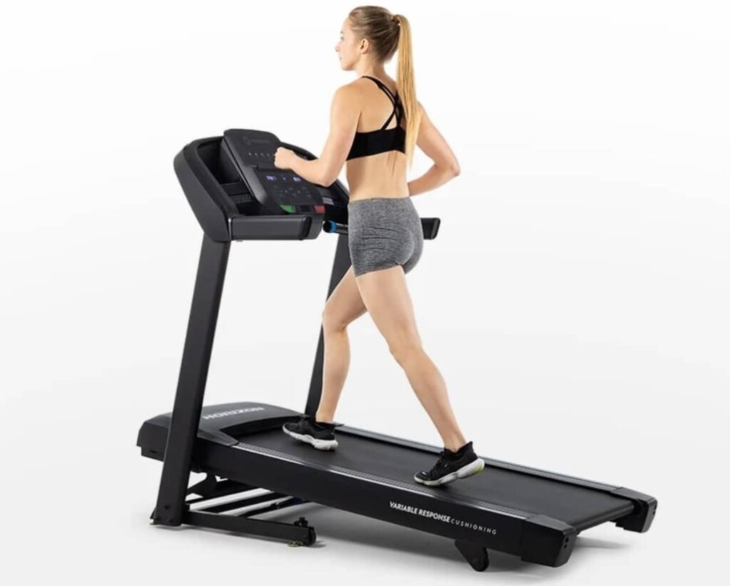 Horizon Fitness T101 Woman Walking Inclined Compressed
