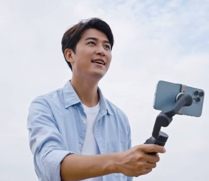 man holding dji gimbal